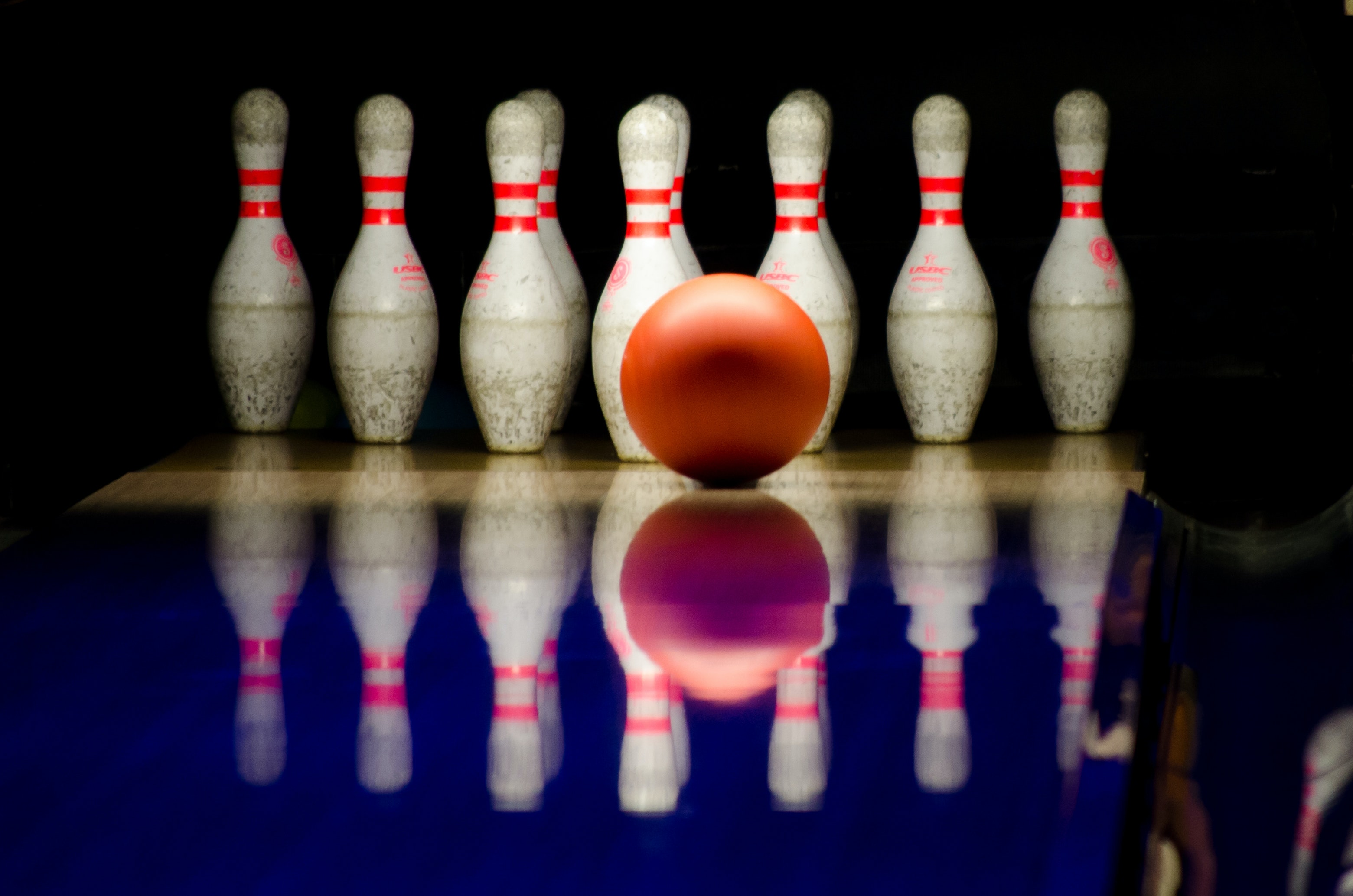 Bowling ball and pins image